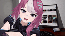 a girl with pink hair is sitting in front of a computer screen with a youtube video on the screen