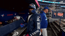 a man wearing a blue jacket that says " the blue jacket "