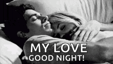 a man and a woman are sleeping in a bed .