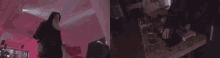 a person is playing a keyboard in a room with pink lights .