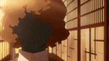 a cartoon character is standing in front of a window in a room with a blurred background .