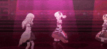 three anime girls are dancing on a stage in front of a pink light .