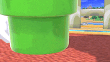 a green pipe in a video game scene