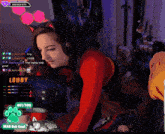 a woman in a cat costume is playing a video game on a twitch channel