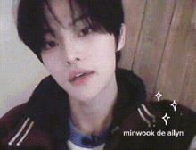 a close up of a person 's face with the name minwook de allyn in the corner