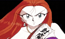 a woman with red hair is holding a book with chinese writing on it