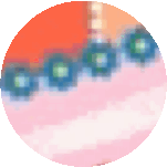 a close up of a circle with a blurred background and a few flowers in it .