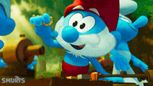 a smurf with a beard and a red hat is holding a gold ring
