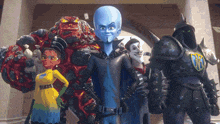 a group of cartoon characters are posing for a picture and one of them is wearing a yellow dress with the letter a on it