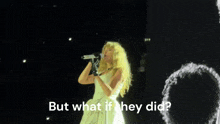 a woman in a white dress is singing into a microphone with the words but what if they did below her