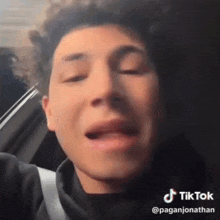 a close up of a man 's face with a tik tok watermark