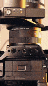a camera that is made in japan with a lens attached