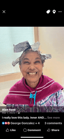 a woman with tinfoil on her head is smiling in a facebook photo
