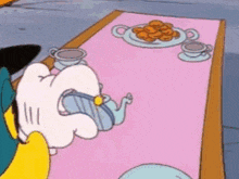 a cartoon character is drinking from a teapot on a table