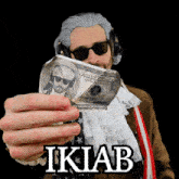 a man wearing a wig and sunglasses is holding a hundred dollar bill in front of his face