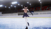 a girl in a black dress is ice skating on a rink