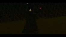 a silhouette of a person in a black coat holding a red object in a dark room .