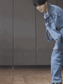 two young men are holding hands and dancing on a wooden floor