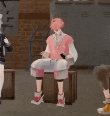 a man in a pink shirt is sitting on a wooden box in a room .