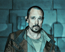 a man with a beard is wearing a jacket