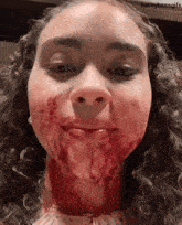 a girl with blood on her face has baileybassgifs in the corner