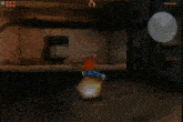 a video game screen shows a character in a blue shirt with the letter t on the back