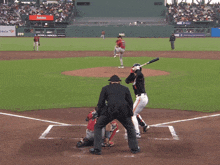 a baseball game is being played in front of a adobe ad