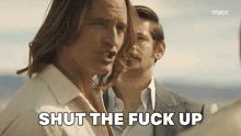 two men are standing next to each other and one of them is saying shut the fuck up
