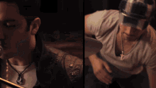 a man singing into a microphone next to another man with a cross necklace