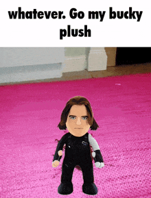 a stuffed bucky standing on a pink rug