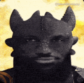 a man with a beard and horns is looking at the camera