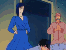 a woman in a blue dress is standing next to two men in pink shirts