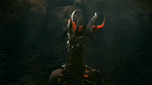 a robot is flying through the air in a dark room in a video game .
