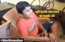 a young boy in a red shirt is sitting in a chair with a caption that says adi kuda correct ye kada sir