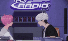 two anime characters talking in front of a radio sign