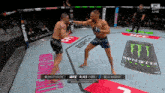 two men are fighting in a boxing ring with a monster energy can behind them