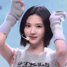 a girl wearing a shirt that says ' girls ' on it