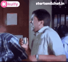 a man is laughing in a room with the words starttamilchat.in on the bottom