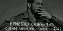 a black and white photo of ernesto guevara cuban minister of industry news