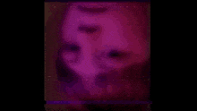 a blurred image of a person 's face with a green background