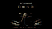 a woman is sitting in a dark room with the words follow us on the bottom