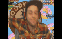 a man wearing headphones is playing a video game called the nerd nexus