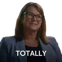a woman wearing glasses and a blue jacket has the word totally on her face