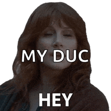 a woman with red hair says " my duc hey " in white letters