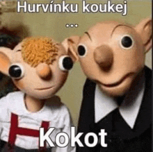 two stuffed animals are standing next to each other and one of them is wearing a shirt that says h .