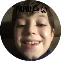 a young boy smiles in a circle with papa written on the top