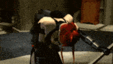 a woman with red hair is kneeling on the floor in a room .
