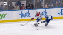 a hockey player with the number 18 on his helmet