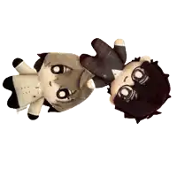 two stuffed animals are upside down on a white surface