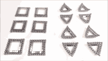 a person is playing with a set of magnetic balls that are shaped like squares and triangles